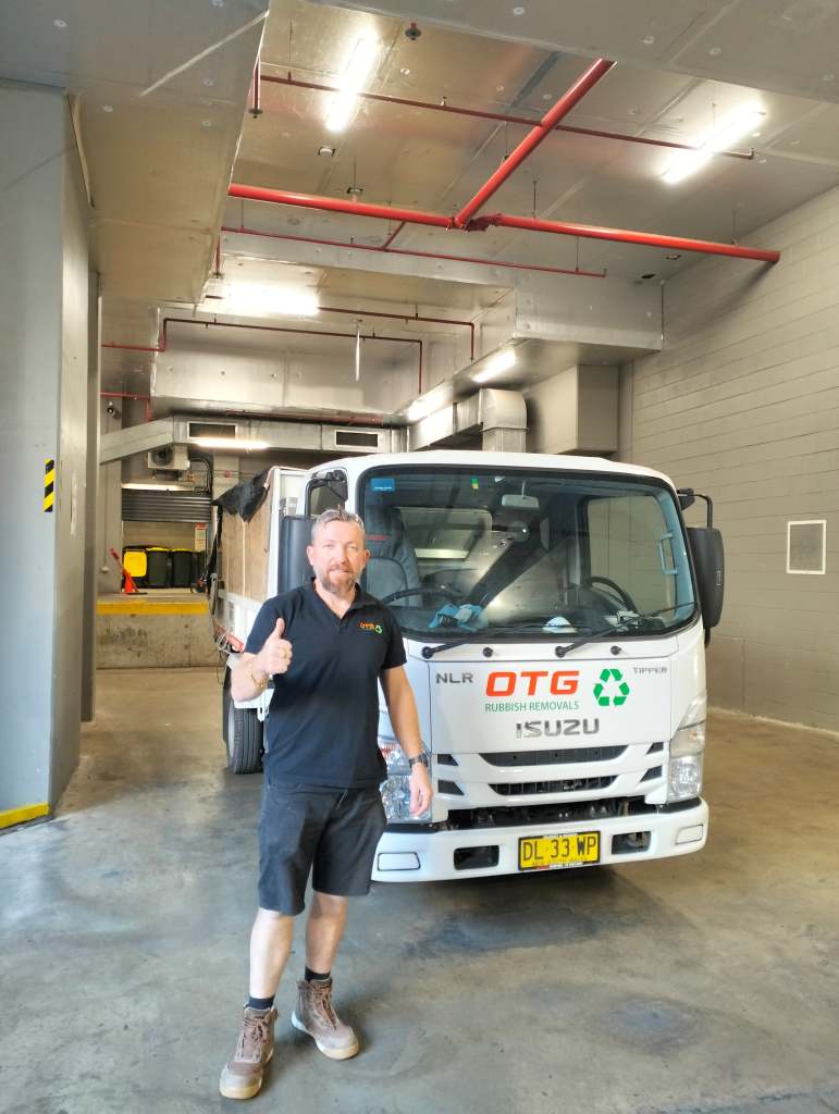 a otg rubbish team member with right hand thumbs up after a job completed in chatswood