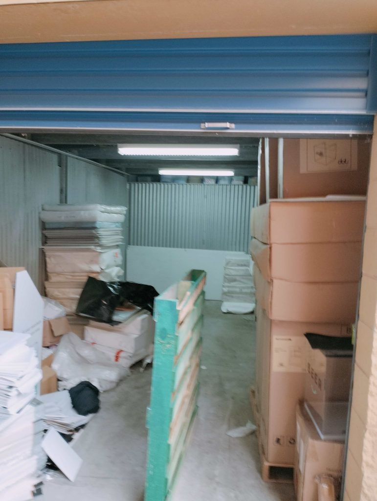 storage unit with lots of cardboard and packaging