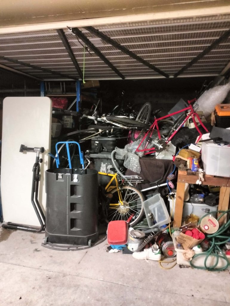 full garage in lane cove unit block full of bikes table plus assorted items
