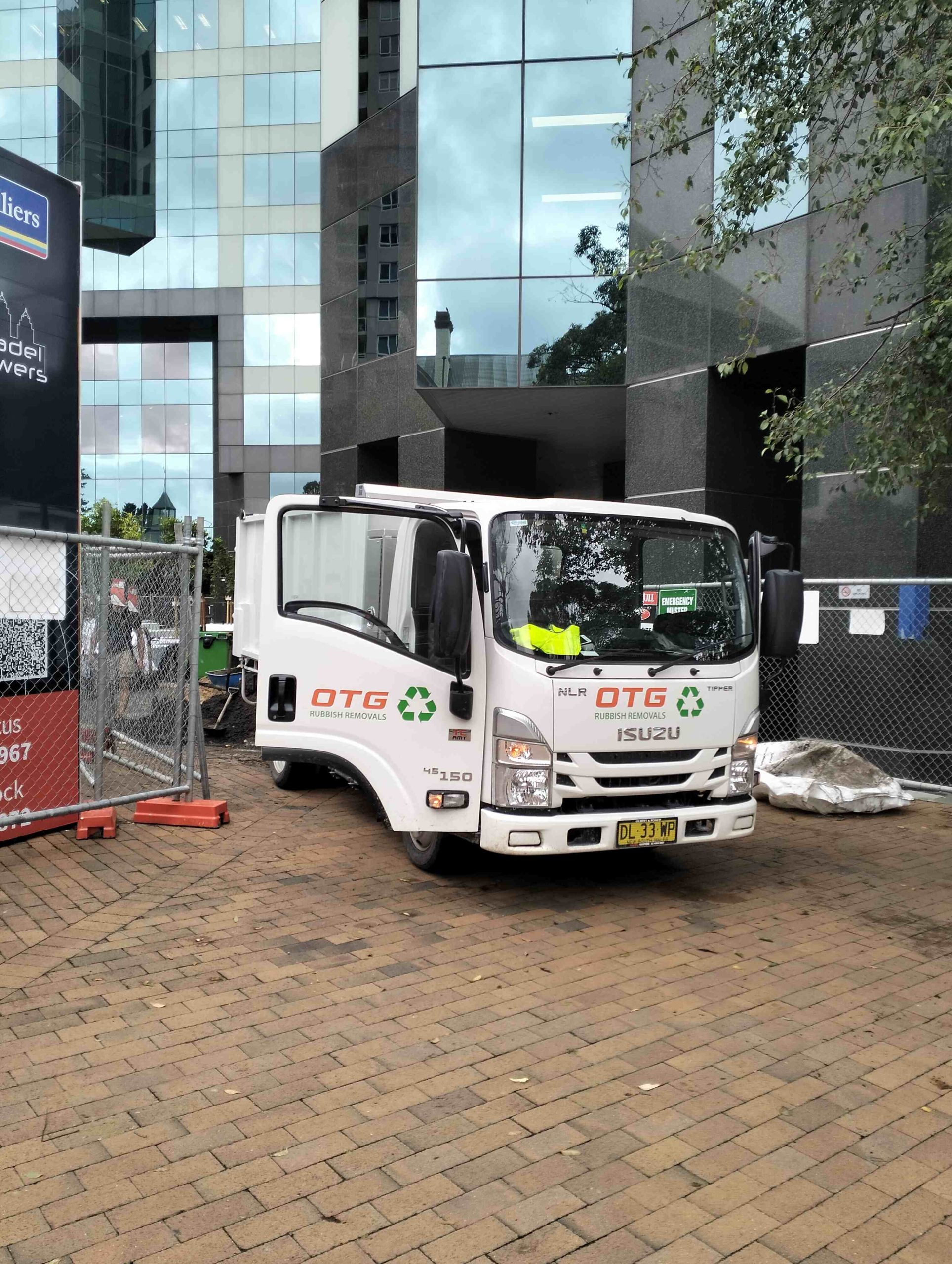 OTG Rubbish REmovals Truck isuzu 45 150 doing a commercial job in Chatswood, Sydney