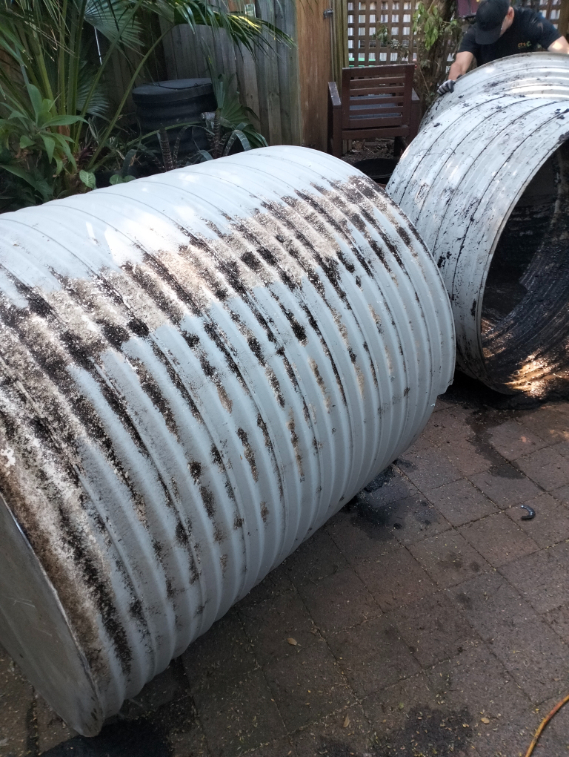 otg rubbish removal tank on ground